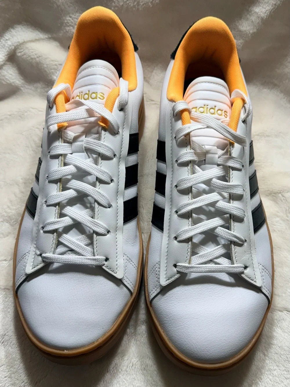 Adidas White Sneakers with Black Stripes and Yellow Lining
